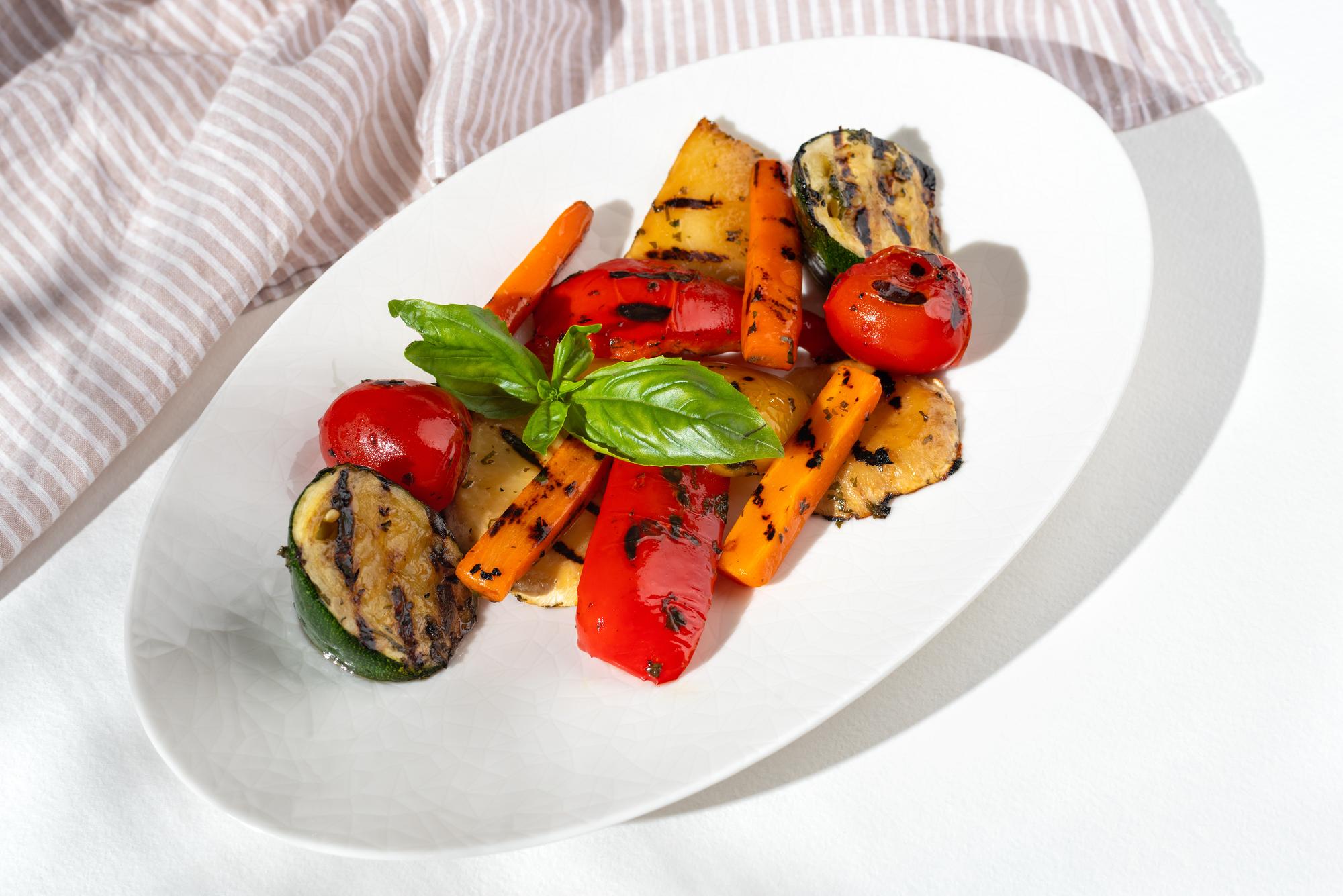 plated roasted vegetables with herbs